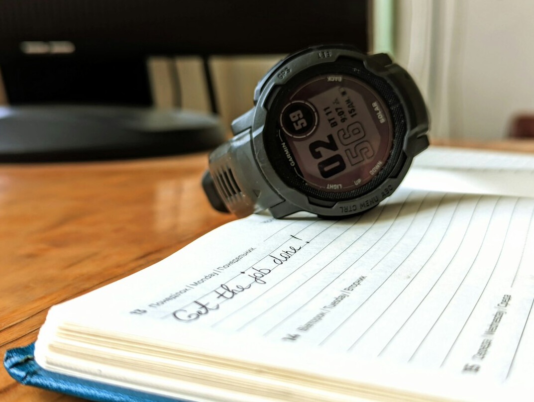 Desk with planning notebook and schedule for coverage tracking
